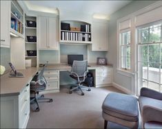 an office with two chairs and a desk