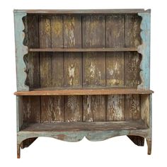 an old wooden shelf with two shelves on each side and one shelf above the other