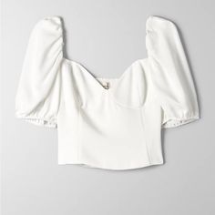 This Is A Square-Neck Blouse With Puff Sleeves And A Fitted Sweetheart Bodice. It's Made From Drapey, Matte Satin Fabric Brand: Wilfred Purchased From Aritzia Feminine Fitted V-neck Puff Sleeve Top, White V-neck Puff Sleeve Top For Brunch, White V-neck Puff Sleeve Top For Day Out, Feminine Fitted V-neck Blouse, V-neck Padded Blouse For Brunch, White Fitted Blouse With Square Neck, Elegant Sweetheart Neckline Crop Top For Spring, Spring White Puff Sleeve Top With Square Neck, Chic White Top With Sweetheart Neckline