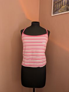 Lovely top from Reebok. From the early 2000's. Pink striped pattern, with blue and white tones as well. Size UK 16. Extendable straps and double layer at the bust. Great condition!  If you have any questions, please do just get in touch.  UK postage is free and sent as second class standard. International shipping is sent as standard. Optional shipping upgrades (such as tracked) are available at the checkout. Thank you for visiting. Y2k Sports Tops For Spring, Y2k Style Sports Tops For Spring, Y2k Style Stretch Tops For Workout, Y2k Style Stretch Workout Tops, Y2k Stretch Tops For Workout, Y2k Style Workout Tops With Stretch, Casual Gym Crop Top With Adjustable Straps, Y2k Striped Cotton Tops, Pink Sports Crop Top