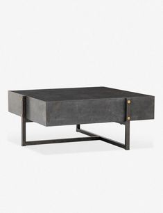 a black coffee table with metal legs and an open drawer on the bottom, in front of a white background