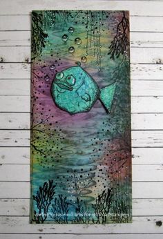 a painting on the side of a wall with fish and bubbles in it's water