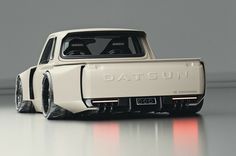 a white truck with the word datsun on it