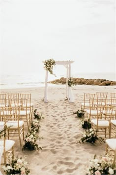 an outdoor ceremony set up on the beach