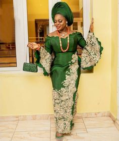 This green African Traditional Asooke dress has an off shoulder with a sweetheart neckline embellished with lace patchwork. In the picture slide is a body measurement and colours to choose from. For best fit, it can be customized according to your body measurement and specification if who contact us. Set Includes: *Compete attire *Gele *Jelwery(Real coral gemstone) *veil Green Evening Dresses, Evening Dresses Lace, Aso Ebi Lace, Blue Mermaid Prom Dress, Yoruba Bride, African Traditional Wedding Dress, Traditional Wedding Attire, Green Evening Dress, African Traditional Wedding