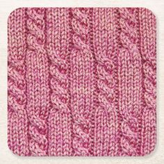 a pink knitted dishcloth on a white background