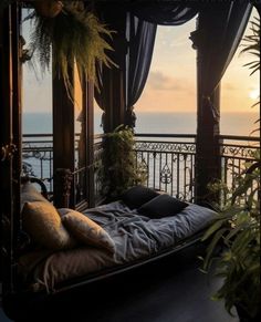 a bed sitting on top of a wooden floor next to a lush green plant covered roof