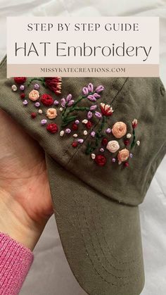 a woman's hand holding a hat with embroidered flowers on it and the words, step by step guide to hats embroidery