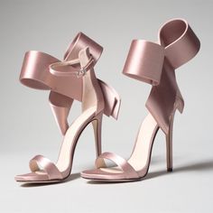 Elevate your bridal style with these Pink Satin Bridal Shoes featuring an oversized bow and ankle strap. These heeled sandals exude elegance, making them perfect for your special day. Color: Pink Material: Satin Heel Type: Stiletto heel Heel height: 4.5" / 115 mm approx Product measurements were taken using size 8. Please note that measurements may vary by size. Toe: Open toe Adjustable ankle strap design Oversized bow embellishment Handcrafted US sizing. Fits true to size. Sandals For Wedding, High Heels Classy, High Heels Black, Manolo Blahnik Heels, High Heels Boots, Chic Heels, Ankle Strap Sandals Heels, Heels Classy, Boutique Bows