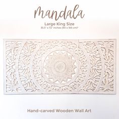 the hand carved wooden wall art is shown