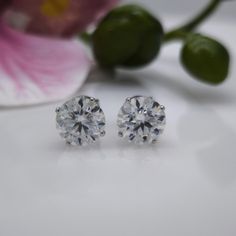 These beautiful Round Colorless Moissanite stud earrings feature a 4-prong design and white gold with push back posts.  ITEM DESCRIPTION:      * Metal: 14k Solid White Gold * Center Stone: 2x8.5mm DEW, 5ct Total Weight Round Colorless Moissanite *Clarity: VS-VVS  *Color: D-E-F(colorless) * Closure: push back FINALE SALE * All the items in my shop are handmade by myself in my workshop, located in Toronto, Ontario, and can be done in SOLID 14K and 18K Gold or Platinum. I will provide you with imag White Gold Crystal Earrings With Brilliant Cut, White Gold Diamond Crystal Earrings With Prong Setting, Classic Diamond Crystal Earrings With Brilliant Cut, Fine Jewelry Round White Gold Crystal Earrings, Fine Jewelry White Gold Crystal Earrings With Prong Setting, Fine Jewelry White Gold Round Crystal Earrings, White Gold Cubic Zirconia Crystal Earrings, Dazzling White Gold Crystal Earrings With Prong Setting, White Gold Crystal Earrings With Prong Setting