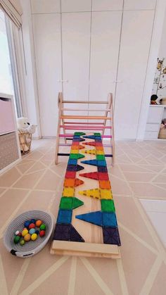 a child's play room with toys on the floor