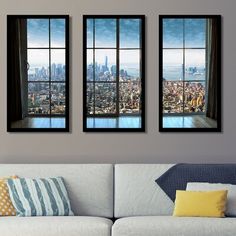 three windows with city view in the background