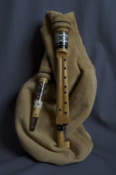 an old recorder is sitting on top of a blanket