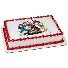 a white and red cake with cartoon characters on it