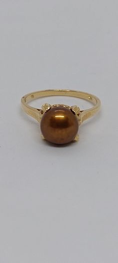 BRONZE Pearl Ring,14k Pearl Engagement Ring, Vintage Pearl Engagement Ring,14K Yellow Gold Bronze Freshwater Pearl. 8-9 mm Pearl Ring. Size 7 Product Info: - Stone: Freshwater Pearl. - Pearl Color: Bronze. - Pearls size: 8-9mm. - Metal: 14K Yellow Gold. - Ring Size 7 - Made in USA. - Nice Gift Box Included Pearl Engagement Ring Vintage, Vintage Hallmarked Pearl Ring, Formal Gold-plated Pearl Ring, Luxury Vintage Gold Pearl Ring, Luxury Antique Gold Pearl Ring, Vintage Gold Hallmarked Pearl Ring, Grey Pearl Necklace, Pearl Engagement Ring, Pearl Set