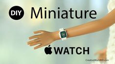 an apple watch with the words miniatureature on it's arm and hands