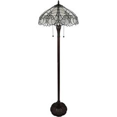 a floor lamp with a glass shade on it