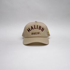 Malibu is a lifestyle. Front: 100% polyester back: 100% nylon - front panel w/lining.Spot clean with distilled soapy water.Trucker style hat. One size fits all. Beige Snapback Trucker Hat For Outdoor, Beige Adjustable Trucker Hat For Streetwear, Beige Trucker Hat With Curved Brim For Outdoor, Beige Trucker Hat For Outdoor, Cream Casual Trucker Hat With Curved Bill, Cream Snapback Trucker Hat For Outdoor, Beige Curved Bill Trucker Hat For Outdoor, Cream Baseball Cap Trucker Hat For Outdoor, Beige Trucker Hat With Curved Bill For Outdoor