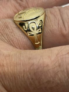 please give me your phone number to speed shipping, I can't ship without it. 18 kt gold Extravagance Ring decorated with Ankh and Lotus flower. Size: You tell me. Weight: around 5 grams. Please give me your phone number to speed shipping, I can't ship without it. Traditional Engraved 14k Gold Ring, Engraved Yellow Gold-plated Oval Ring, Engraved Oval Yellow Gold-plated Ring, Engraved Yellow Gold Plated Ring, Gold Jewelry Stamped 14k For Marriage, Traditional Gold Oval Signet Ring, Oval Hallmarked Gold-plated Signet Ring, Gold 14k Stamped Jewelry For Marriage, Traditional 14k Stamped Yellow Gold Rings