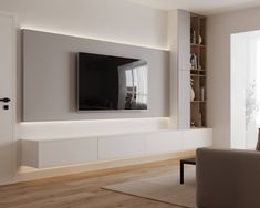 a living room with a large flat screen tv mounted on the side of it's wall