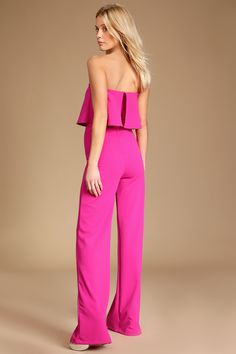 You'll be absolutely irresistible when you're wearing the Lulus Power of Love Magenta Strapless Jumpsuit! Stretch crepe knit shapes a strapless bodice with a fluttering tier, hidden V-bar, and no-slip strips. A high, fitted waist tops relaxed wide leg pants. Hidden back zipper. Fit: This garment fits true to size. Length: Floor length. Size medium measures 55" from top to bottom. Inseam: 32.00 Front Rise: 14.00 Bust: Works best for A to C cup sizes - consider sizing up for fuller bust. Waist: Fi Fitted Strapless Jumpsuit For Spring, Strapless Ruffled Jumpsuits And Rompers For Date Night, Strapless Sleeveless Ruffles Jumpsuit For Date Night, Flirty Strapless Jumpsuits For Date Night, Strapless Flirty Jumpsuits For Spring, Pink Strapless Jumpsuits And Rompers For Party, Flirty Strapless Jumpsuit For Date Night In Spring, Flirty Strapless Jumpsuits And Rompers For Date Night, Strapless Ruffled Jumpsuits And Rompers For Spring