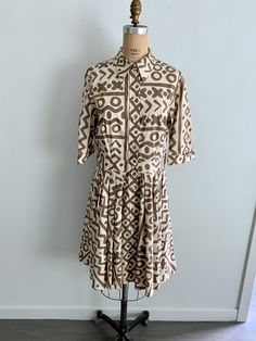 "This cotton batik print drop waist shirt dress with 3/4 length sleeves is super chic. Button front with pleated skirt it's a classic style with a twist.  100% cotton  Size- M/L-marked 12 Measurements: Bust=38\" Waist=32\" Hip=44\"-free  Sleeve=14.5\" Length=40\" Shldr 2 shldr= 16\" Excellent vintage condition. No visible signs of wear, damage or stains." Batik Print Dress, Vintage Dress 80s, Batik Print, Moschino Cheap And Chic, 80s Dress, Batik Prints, Chic Vintage, Philadelphia Pa, Drop Waist