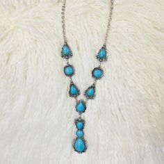 This western style turquoise stone tear drop inspired necklace is gorgeous. The tear drop shapes paired with the round stones inlayed in a silver background makes these stones stand out. The necklace is the perfect addition to any western or southwestern outfit. 20" chain with a 3" drop dangle. Southwestern Outfits, Silver Background, Inspired Necklace, Stone Inlay, Sterling Jewelry, Wedge Heel Sandals, Glitz And Glam, Accessories Rings, Tear Drop