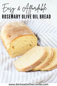 a loaf of homemade rosemary olive oil bread on a striped cloth with text overlay