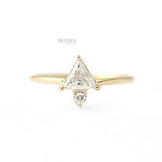 a yellow gold ring with a triangle shaped diamond