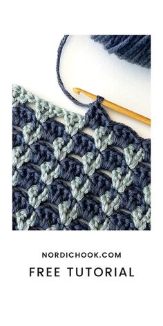 the crochet pattern is shown with yarn and knitting needles on top of it