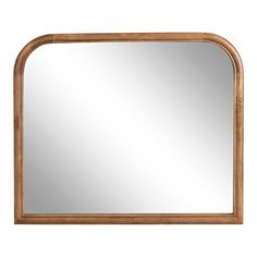 a wooden framed mirror on a white wall with a light brown frame and wood trim