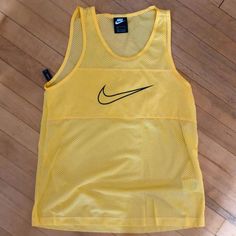 Never Worn. Bold Yellow. Mesh Front And Full Mesh Back. Loose Fit Nike Summer Beach Top, Yellow Sports Tank Top For Spring, Yellow Tank Top For Sports In Spring, Casual Yellow Workout Tank Top, Nike Yellow Summer Tops, Yellow Nike Summer Tops, Yellow Nike Tops For Summer, Nike Casual Tank Top For Summer, Nike Yellow