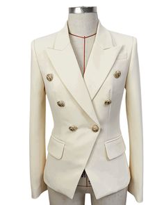 Veronica Off White Double Breasted Blazer with Gold Buttons - SLIM FITFeatures: - Slim Fit Design - Single Gold Button Closure - Gold Button Cuffs - Peak Lapels - Two Faux Side Pockets - Shoulder Padding The Veronica Off White Double Breasted Blazer is the epitome of timeless elegance and sophistication: our off-white double breasted blazer with luxurious gold buttons. This blazer is the perfect addition to any wardrobe, exuding an air of power, femininity, and class that is simply unmatched. Crafted with exceptional attention to detail, this blazer is designed to last, with premium materials and impeccable craftsmanship that ensure you get the most out of your investment. The tailored fit flatters your figure, creating a silhouette that is both chic and powerful. The off-white colour is a White Double Breasted Blazer, Faux Fur Accessories, Off White Blazer, Chic Outerwear, Blazer For Women, Long Faux Fur Coat, Embellished Jacket, Wool Blend Jacket, Denim Blazer