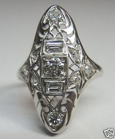 an antique style diamond ring on a white background