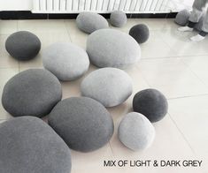 several gray and white rocks laying on the floor