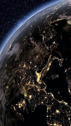 the earth is lit up at night from space