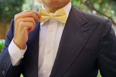 OTAA's elder brother, Mr. Haroon, attributes the brand's impeccable tailoring of their Light Yellow Satin Bow Tie to "a combination of cut, cloth and attention to detail." From its subtly smooth satin and dapper sheen feel to the elegantly slim fit, the OTAA Light Yellow Satin Pre-tied bowtie excels on all three counts. Handcrafted, this style is finished with smooth, satin-blend lining and internal stitching for complete robustness. Wear it against a stark white shirt to play up the rich hue.