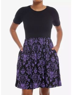 Keep it stylish, yet casual, in the afterlife with this dress from The Haunted Mansion! This t-shirt dress features the iconic wallpaper design from the beloved attraction printed at the skirt and a solid black bust. Comes with an elasticated waistband and side seam pockets.