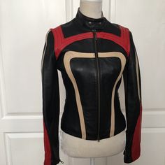 This Italian-Made Jacket Is A Must-Have For Any Fashion-Forward Woman. The Corset Style Is Crafted From Italian Genuine Leather And Features A Colorblock Design With Accents Of Geometric Patterns. The Jacket Has A Classic Fit And Is Available In Size S, Making It Perfect For Any Occasion. The Closure Has A Zipper And Snaps At The Neck. The Jacket Is Fully Lined With A Lightweight Polyester Quilted Lining. The Sleeves Are Long With Zipppers At The Wrists It Also Has Two Zippered Pockets. The Cors Corset Jacket, Chic Leather, Leather Corset, Character Ideas, Fashion Costume, Corset Style, Geometric Patterns, Zipper Pocket, Color Blocking