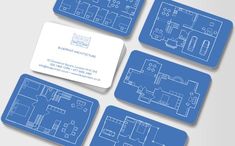 four business cards with blueprinted floor plans on them