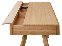 a wooden desk with an open drawer on it