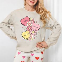 Looking for a cute versatile top to wear this summer? Make sure to grab one of our Cursive Fall Leaf Sweatshirts! This soft and comfortable shirt is the perfect top for any outfit. It can be paired with biker shorts, Jeans, or the classic stay at home sweats! The bright color adds a pop of summer to any outfit. This sweatshirt is true-to-size, so be sure to order your regular size! If you are looking for a more oversized look, make sure to size up. Relaxed Fit Crew Neck Top With Heart Print, Sweet Long Sleeve Graphic Print Top, Sweet Long Sleeve Tops With Graphic Print, Spring Heart Print Crew Neck Tops, Cute Tops With Heart Graphic For Spring, Trendy Relaxed Fit Top With Heart Print, Relaxed Fit Heart Print Tops For Spring, Spring Tops With Heart Print And Relaxed Fit, Heart Print Tops With Relaxed Fit For Spring