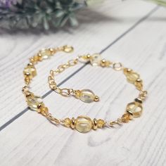 Add a touch of sunshine to your jewelry collection with this stunning 14k Gold Citrine Bracelet. Featuring vibrant citrine gemstones, known for their warm, golden hues, this bracelet exudes positivity and energy. Each citrine bead is beautifully faceted to catch the light, creating a radiant sparkle with every movement. The delicate gold chain is adorned with intricate beading, enhancing the elegance of this bracelet and making it a perfect accessory for both casual and formal occasions. Citrine is often associated with success and prosperity, making this bracelet not only a beautiful addition to your wardrobe but also a meaningful piece to wear daily. ◊ Measurements & Materials: Metal: 14K yellow gold Gemstone: Natural Citrine Gem Size: The coin citrines are 5mm in dia., the small citrine Gold Arm Band, Delicate Gold Chain, Intricate Beading, Citrine Bracelet, Citrine Beads, Gold Armband, Natural Citrine, November Birthstone, Citrine Gemstone