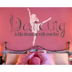 a ballerina is dancing with your feet wall decal in pink and gray on a bed