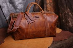 "25% off for 5 pcs to 9 pcs. 30% off for 10 pcs to 14 pcs. 35% off for 15 pcs or more. Discount shown at checkout. Distressed leather duffle bag for your most exciting trips, Vintage inspired design combined with the distressed leather gives a rich classy look. It is quite spacious and can easily store a 15\" iPad or laptop. You can also store a lot of essential items in this bag. The shoulder strap also features metal rings which recede when not being used. Available in two exquisite shades of Brown Portable Bag As Gift, Brown Travel Bag For Gift, Classic Portable Leather Bags, Portable Leather Bag As A Gift, Classic Portable Travel Bag, Brown Travel Bag With Luggage Sleeve As Gift, Luxury Rectangular Travel Bag For Gift, Luxury Rectangular Travel Bag As Gift, Luxury Rectangular Travel Bag Gift