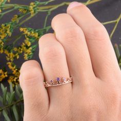 "Crown ring, Gold wedding ring, Amethyst ring, Rose gold ring, Purple stone ring, February birthstone, Women wedding ring, Gold crown ring WE OFFER UNLIMITED PERIOD INSTALLMENTS PLAN This is a beautiful, stunning, feminine ring that works well for all occasions, styles, and ages. You will love it! Ring information: Stone: Amethyst Approximate size: central stone - 2mm, 2 accent stones 1.5mm Metal type: Gold Metal stamp: 14k Gold Customization / Replacements It's easy to create jewelry that's per Rose Gold Amethyst Birthstone Ring For Promise, Rose Gold Amethyst Birthstone Promise Ring, Rose Gold Crystal Birthstone Promise Ring, Rose Gold Crown Design Ring As Gift, Rose Gold Solitaire Amethyst Wedding Ring, Rose Gold Birthstone Ring For Wedding, Dainty Rose Gold Amethyst Promise Ring, Rose Gold Wedding Ring With Birthstone, Rose Gold Solitaire Amethyst Promise Ring