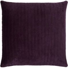 a purple velvet pillow on a white background