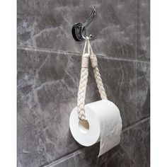 a roll of toilet paper hanging from a rope