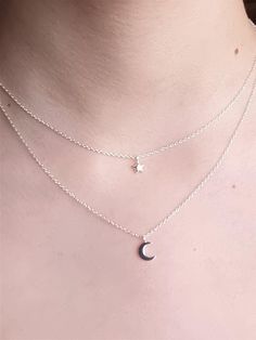 This beautiful layered moon and star necklace is made of 925 Sterling Silver, complete with Sterling Silver Moon and Star Charms.  The chain measures 45cm in length. It is minimalist yet elegant, and is designed to be worn day or night, making the perfect birthday gift for someone you love. All MysticSilver jewellery is 925 Sterling Silver, Hypoallergenic, and is Nickel and Lead free. PACKAGING Your order will be carefully wrapped in specially formulated tissue paper, which is designed to ensure your jewellery stays tarnish free, and then placed in a pretty organza bag. Or you can choose to upgrade to one of our beautiful MysticSilver gift boxes, which make the perfect packaging for presents. DELIVERY Your order will be posted usually within 1-2 working days by Royal Mail second class post Silver Layered Moon Charm Necklace For Gift, Silver Layered Necklace With Moon Charm As A Gift, Silver Layered Necklace With Moon Charm For Gift, Moon And Star Necklace, Necklace Aesthetic, Necklace Combo, Silver Necklace Simple, Layered Necklaces Silver, Jewellery Necklace